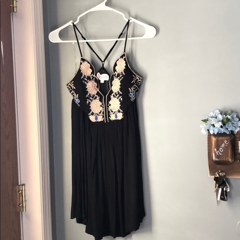 Mini black dress with floral design in front